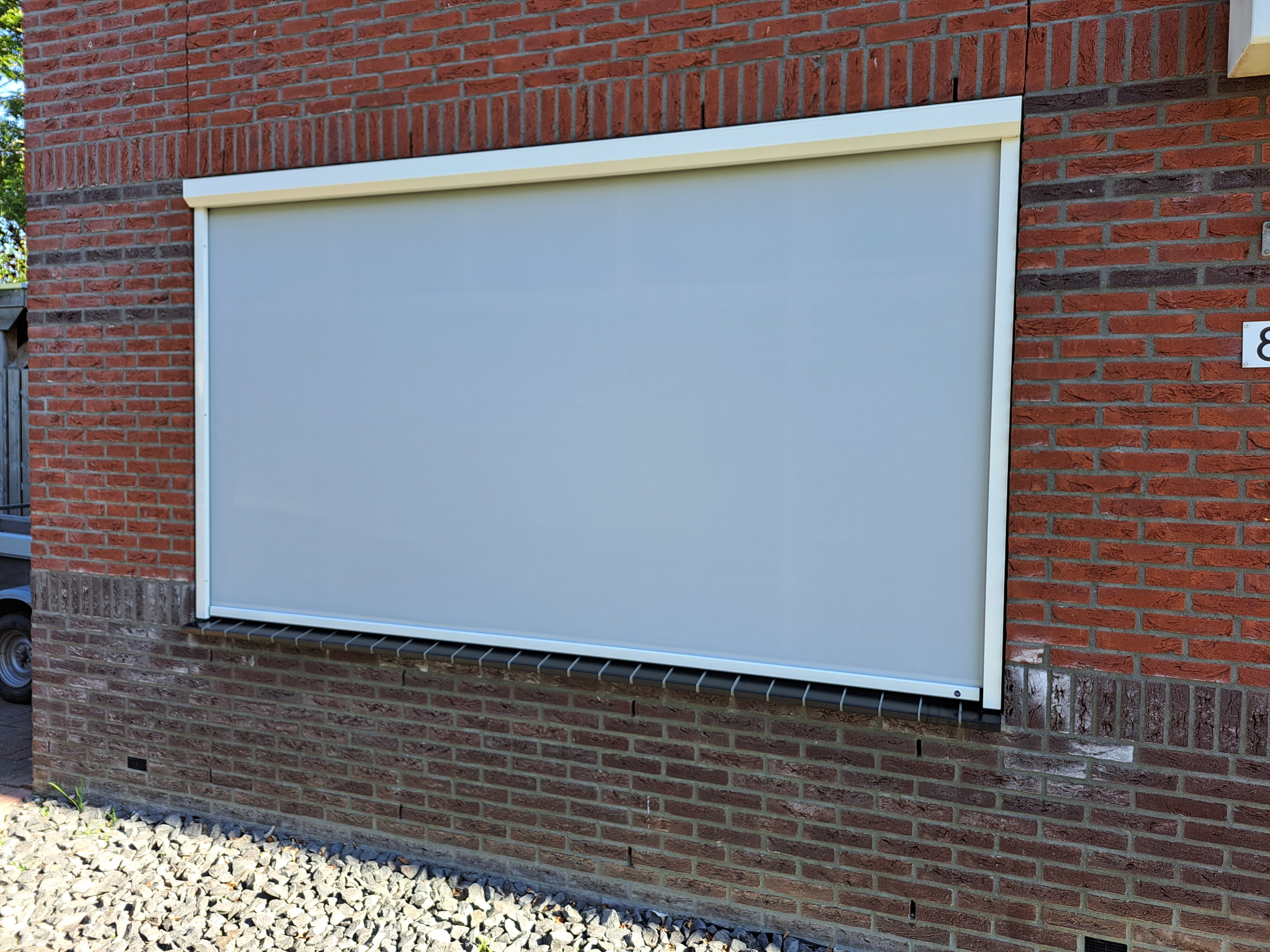 Screen op bakstenen woning